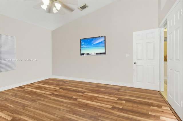 spare room featuring hardwood / wood-style floors and ceiling fan