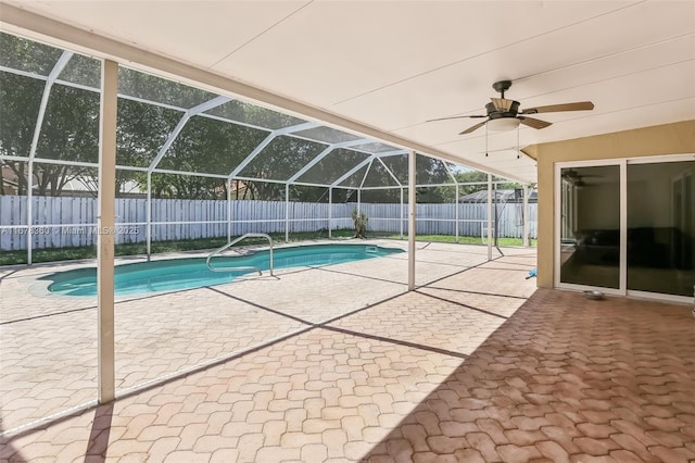 view of pool featuring a lanai, a patio area, and ceiling fan