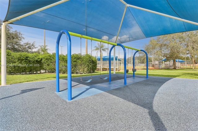 view of playground with a yard