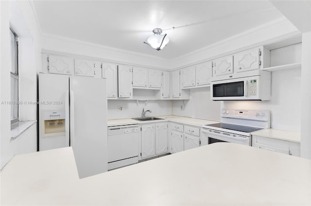 kitchen featuring ornamental molding, sink, white cabinets, and white appliances