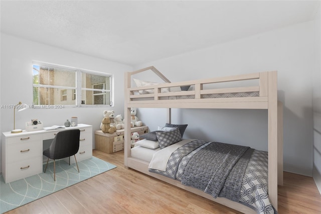 bedroom with light hardwood / wood-style floors