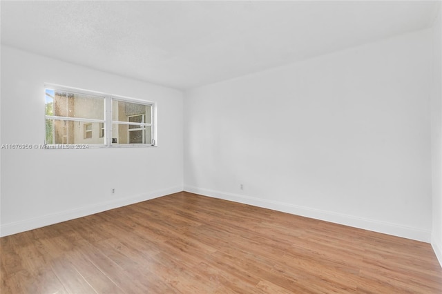 unfurnished room featuring light hardwood / wood-style flooring