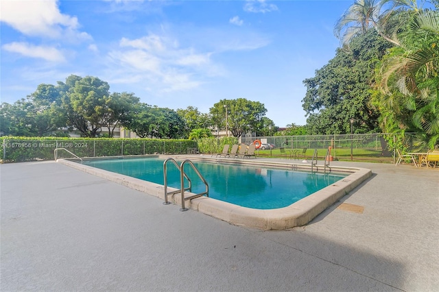 view of pool featuring a patio