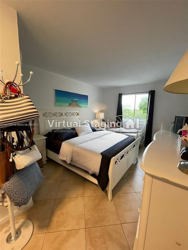 bedroom featuring light tile patterned floors