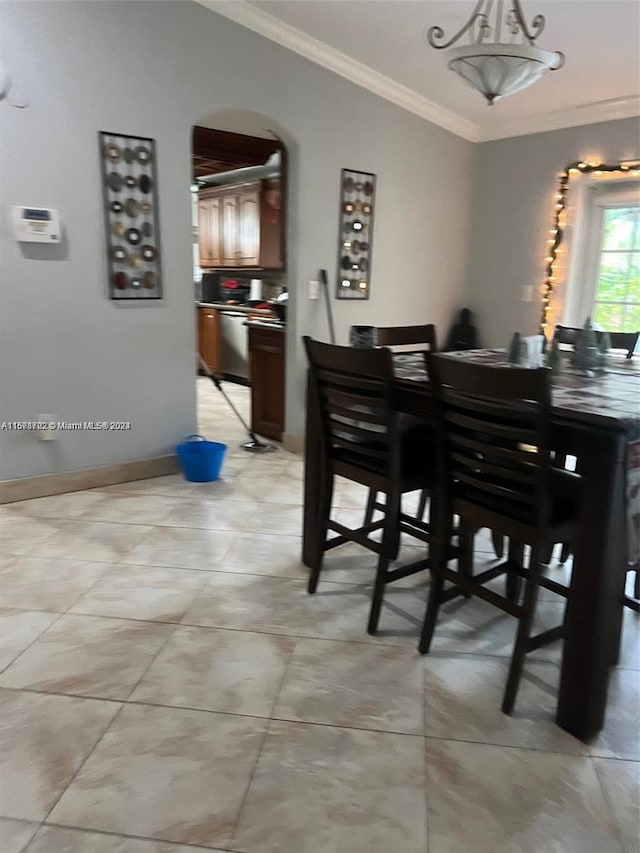 dining room with crown molding