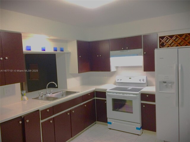 kitchen featuring stove, light tile patterned flooring, sink, and white refrigerator with ice dispenser