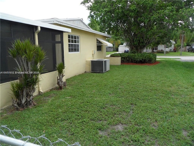 view of yard featuring central air condition unit