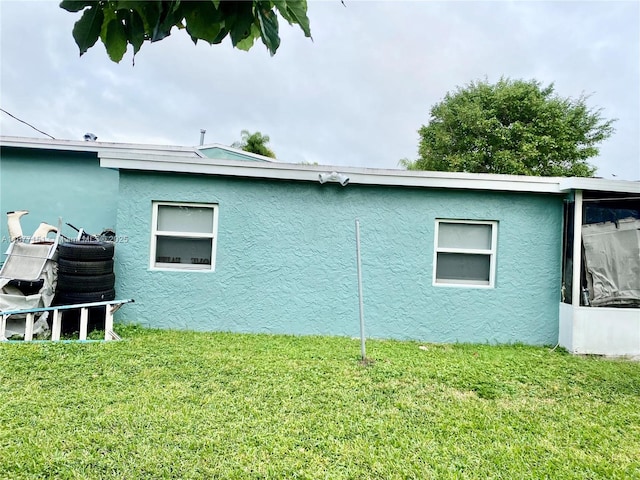 view of home's exterior featuring a yard