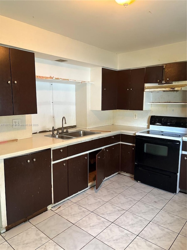 kitchen with dark brown cabinetry, black range with electric stovetop, and sink