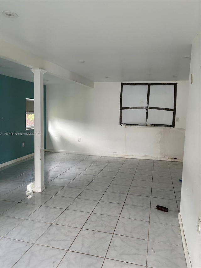 unfurnished room featuring light tile patterned floors