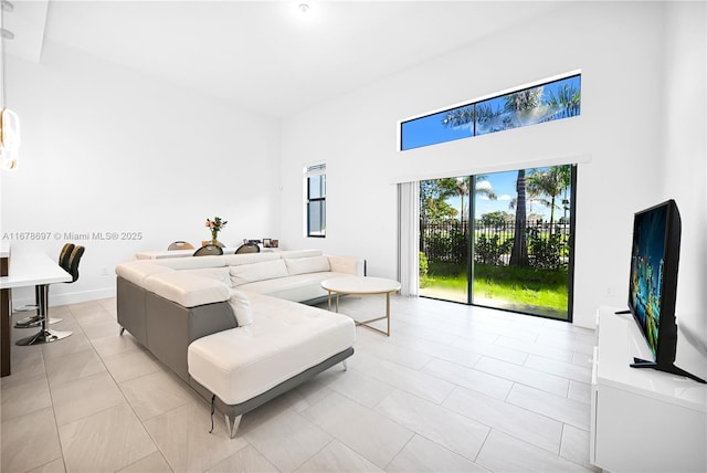 living room with light tile patterned flooring