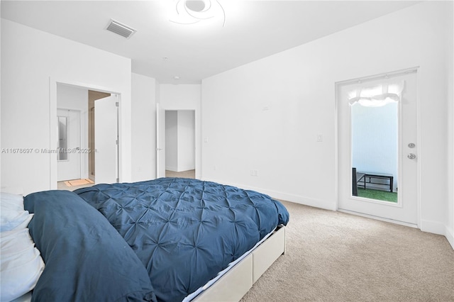 bedroom with light colored carpet