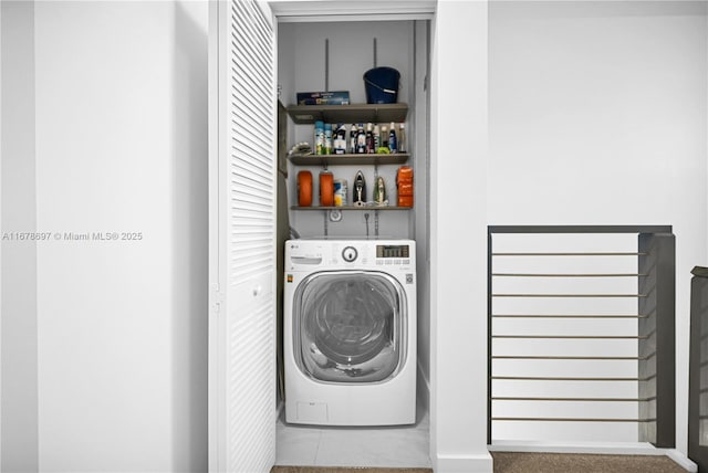 washroom featuring tile patterned floors and washer / clothes dryer