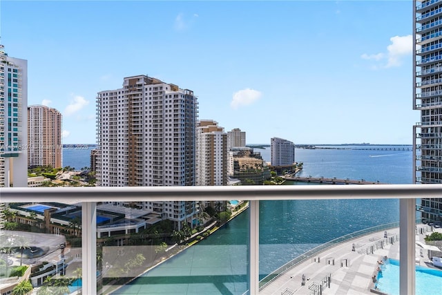 balcony featuring a view of city and a water view