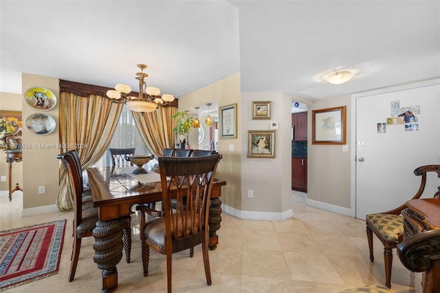 dining area featuring a chandelier