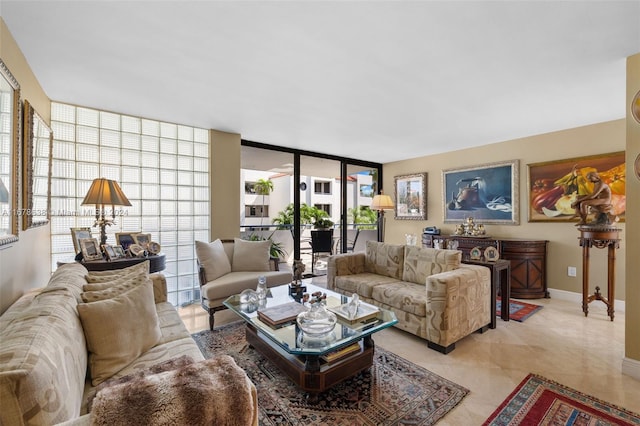 living room featuring expansive windows and a healthy amount of sunlight