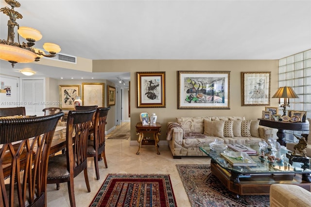 living room featuring a notable chandelier