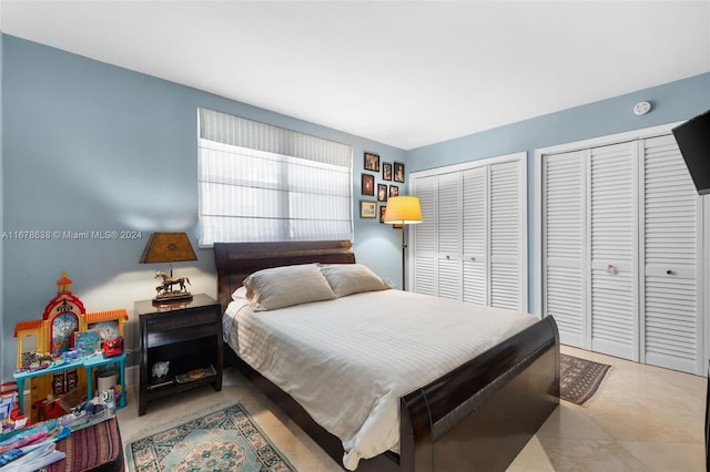 bedroom with two closets