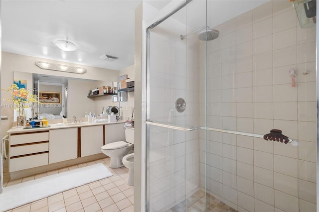 bathroom featuring vanity, a shower with shower door, a bidet, and toilet