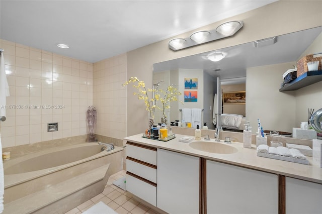 bathroom with vanity, a tub to relax in, and tile patterned flooring