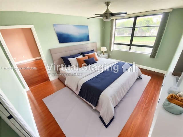 bedroom featuring ceiling fan and wood-type flooring