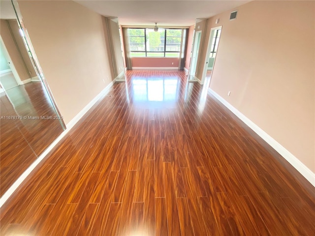 empty room featuring dark wood-type flooring