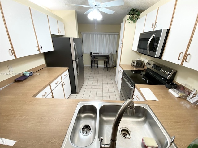 kitchen with white cabinets and stainless steel appliances