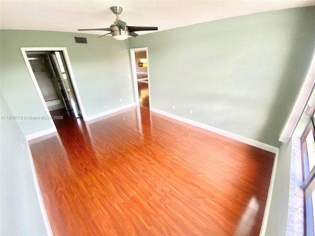 unfurnished room featuring ceiling fan and wood-type flooring