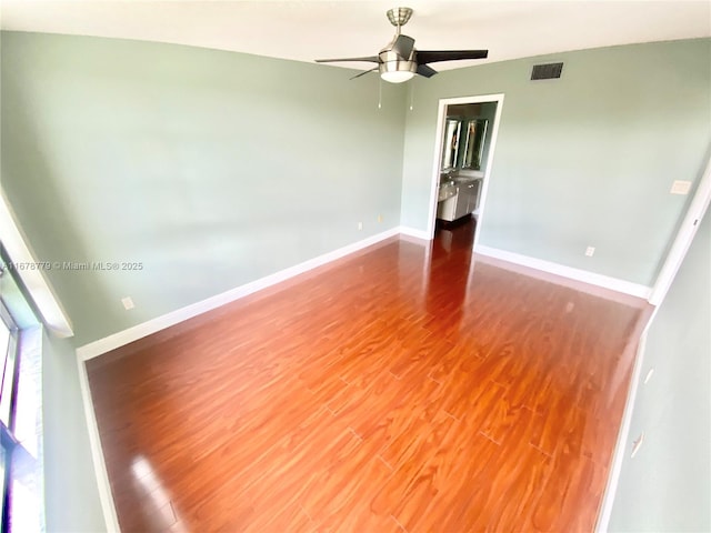 spare room featuring ceiling fan and wood-type flooring