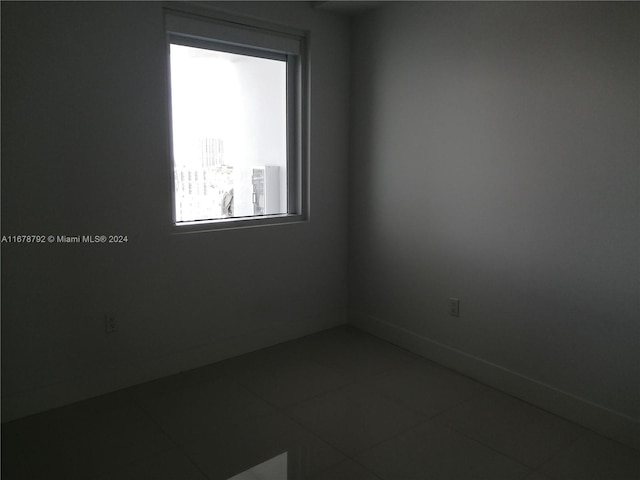 empty room featuring tile patterned floors