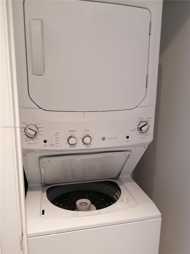 laundry room with stacked washer and dryer