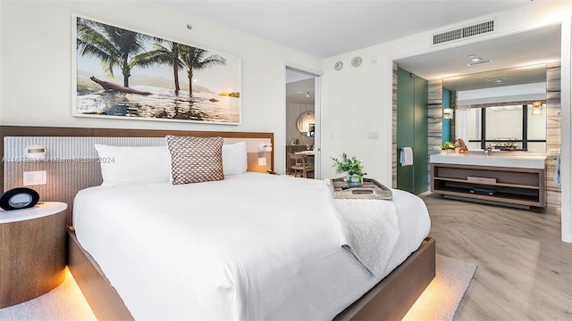 bedroom featuring light wood-type flooring