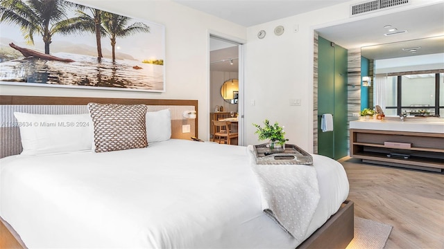 bedroom featuring hardwood / wood-style flooring