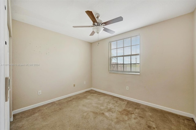 carpeted empty room with ceiling fan