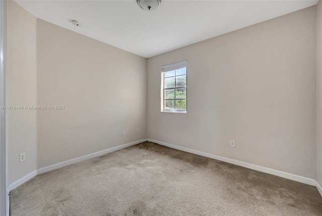 unfurnished room featuring carpet floors