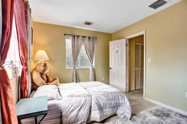 bedroom featuring light carpet