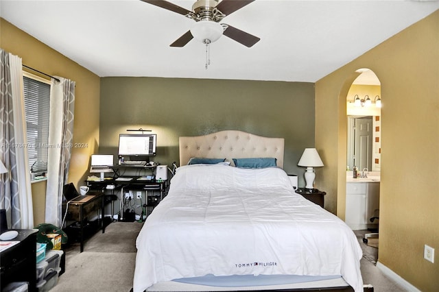 bedroom featuring carpet flooring, sink, connected bathroom, and ceiling fan