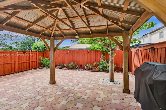 view of patio featuring a gazebo and a grill