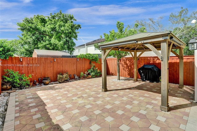 view of patio / terrace featuring a gazebo and area for grilling