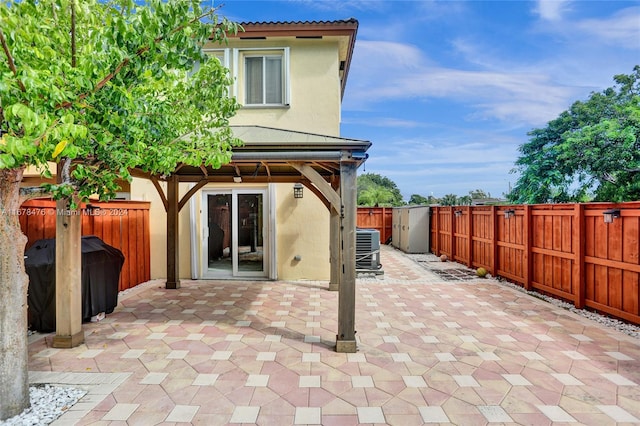 view of patio / terrace featuring central AC unit and grilling area