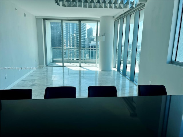 dining room featuring floor to ceiling windows