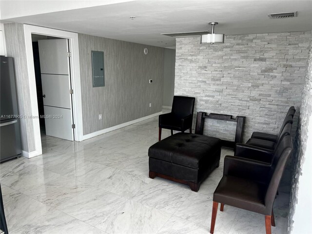 92 SW 3rd Unit 3605, Miami, FL 33130 - sitting room with electric panel, marble finish flooring, and baseboards