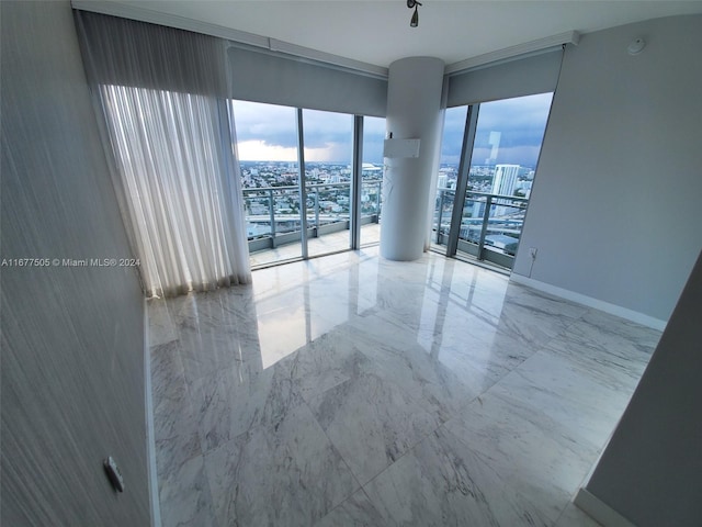 92 SW 3rd Unit 3605, Miami, FL 33130 - empty room with a city view and marble tiled flooring