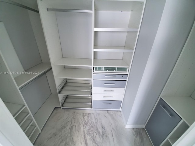 92 SW 3rd Unit 3605, Miami, FL 33130 - walk in closet featuring marble look tiles