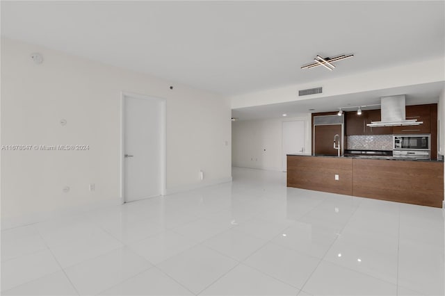 interior space featuring sink and light tile patterned flooring