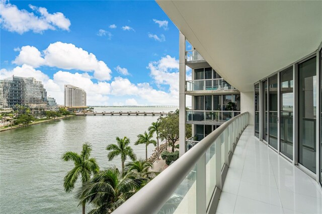 balcony featuring a water view