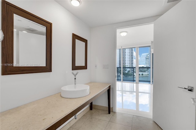 bathroom with sink and tile patterned flooring