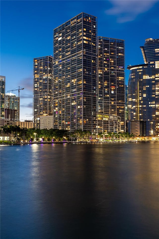 outdoor building at dusk featuring a water view