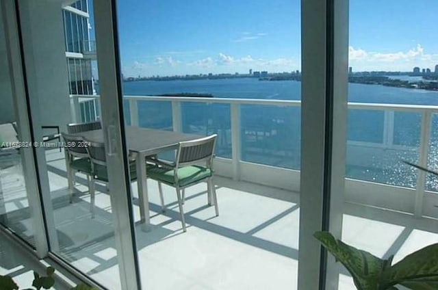 balcony featuring a water view