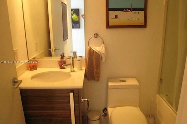 full bathroom with vanity, shower / tub combination, and toilet